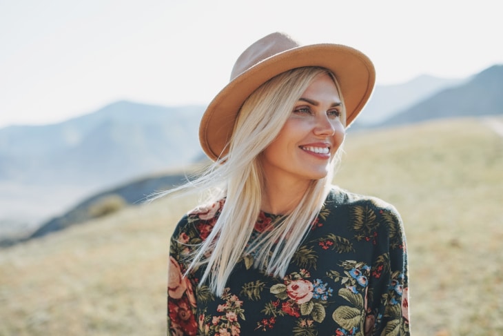 Happy Woman Who Must Be Looking at a Beautiful Shaved Head